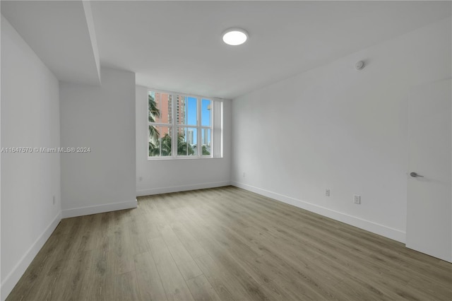 spare room with light hardwood / wood-style flooring