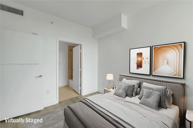 bedroom with light wood-type flooring