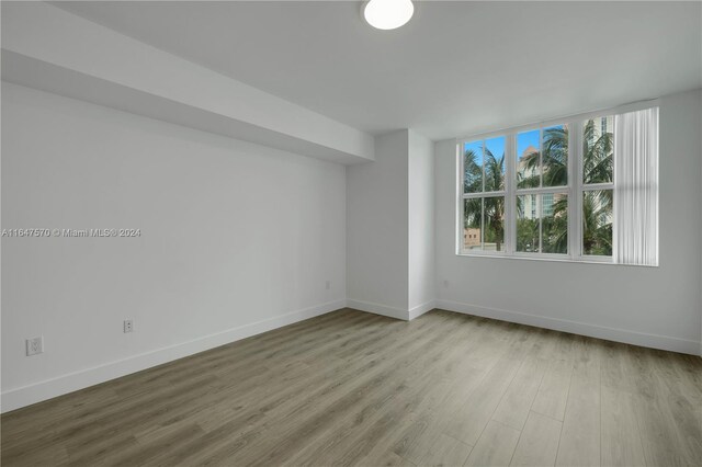 spare room featuring light hardwood / wood-style flooring