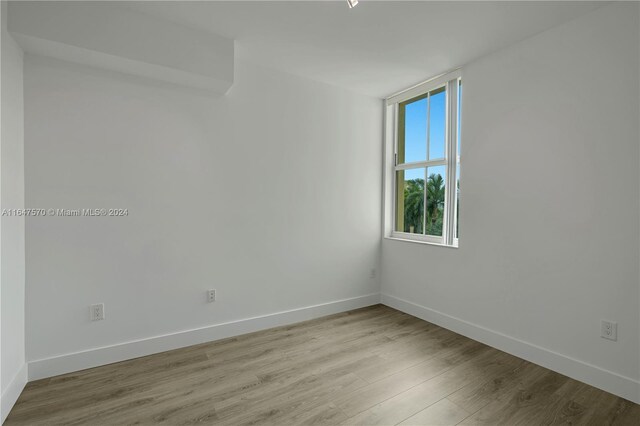 unfurnished room featuring light hardwood / wood-style flooring