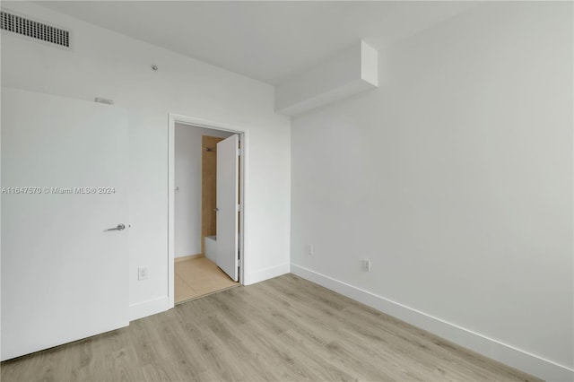 spare room with light wood-type flooring