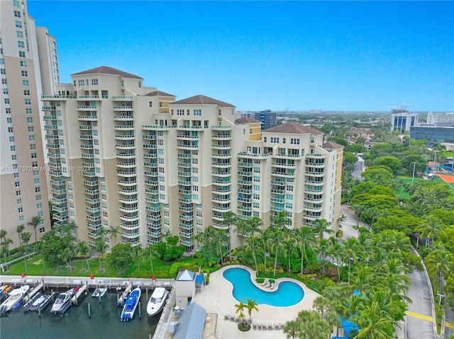 view of building exterior featuring a community pool