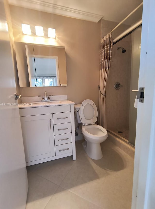 bathroom featuring ornamental molding, vanity, tile patterned floors, curtained shower, and toilet