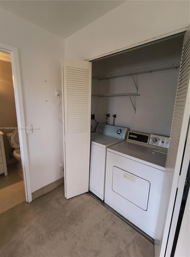 clothes washing area with independent washer and dryer