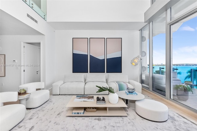 living room with visible vents and wood finished floors