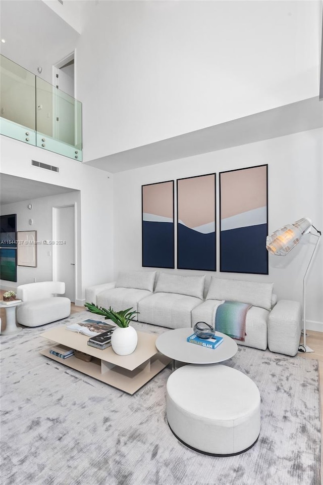 living room with a towering ceiling