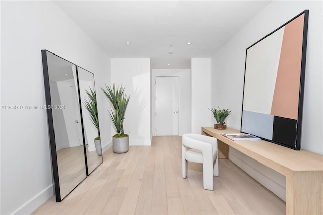 office area featuring recessed lighting, baseboards, and light wood finished floors
