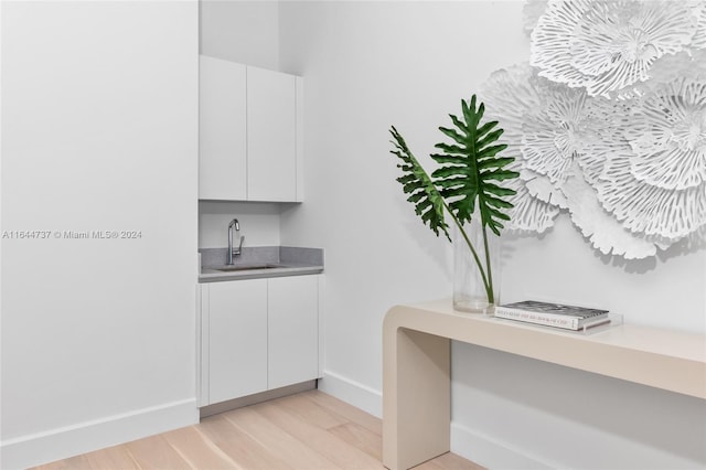 bathroom featuring sink and hardwood / wood-style floors