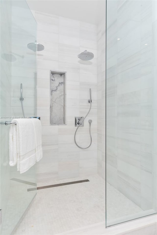 bathroom with a tile shower