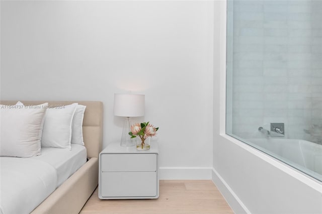 interior space featuring light wood-style floors and baseboards