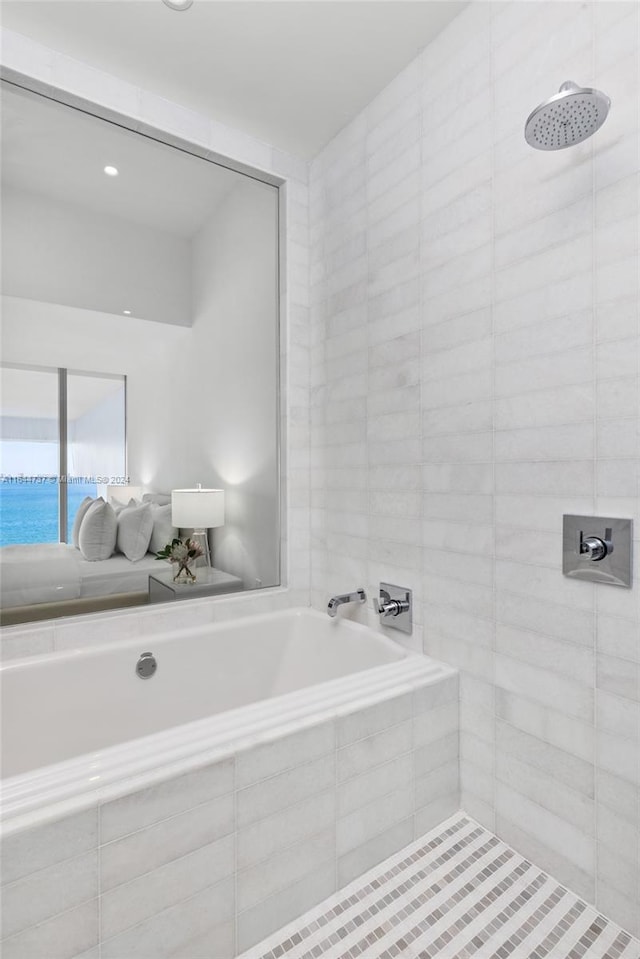 full bath with a tile shower and a garden tub