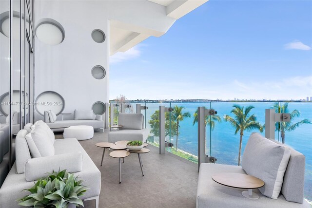 balcony featuring an outdoor hangout area and a water view
