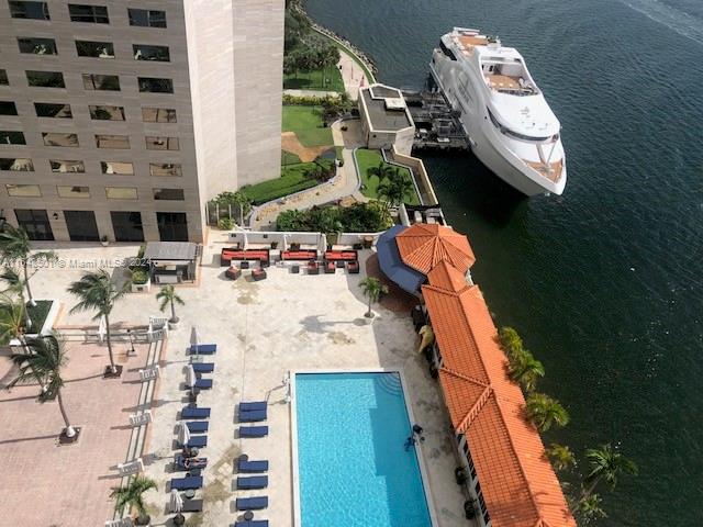 view of pool with a water view