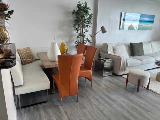 dining space with hardwood / wood-style floors