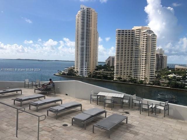 view of patio with a water view