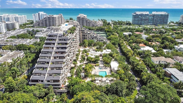 bird's eye view featuring a water view and a city view