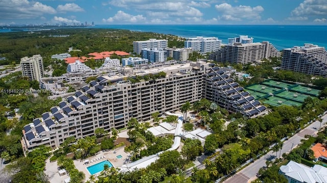 bird's eye view featuring a water view and a city view