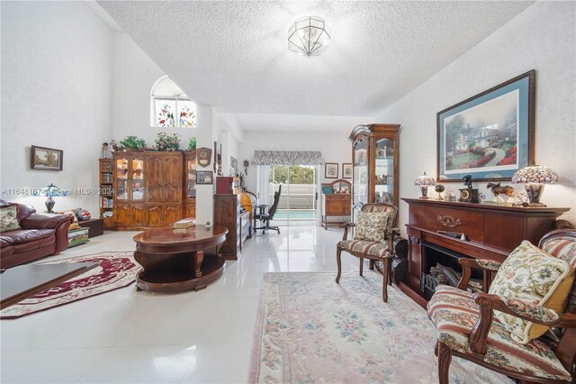 tiled living room with a textured ceiling