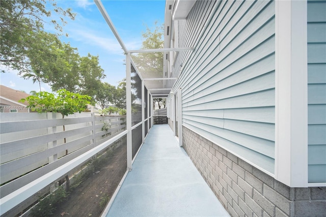 view of side of property featuring fence