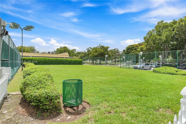 view of yard featuring fence and cooling unit