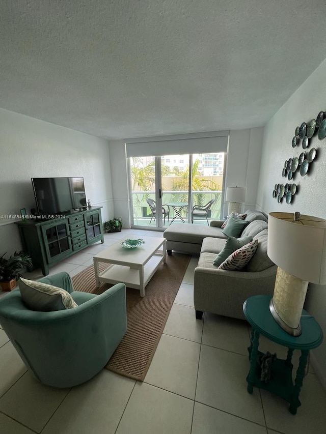 tiled living room with a textured ceiling