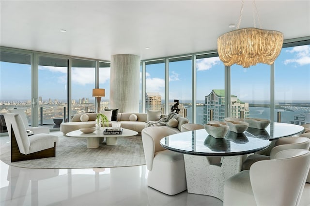 sunroom with a water view, a wealth of natural light, and a chandelier