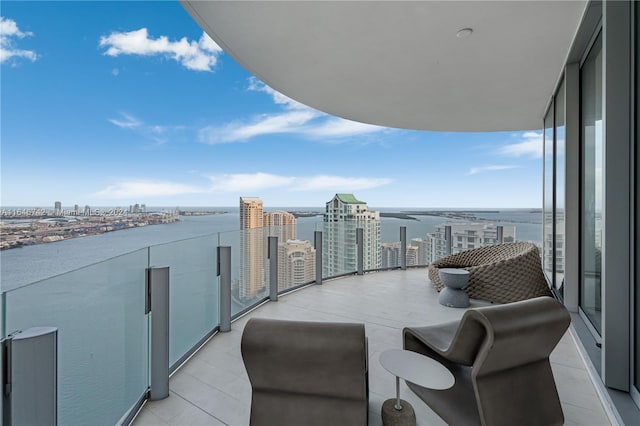 balcony featuring a water view