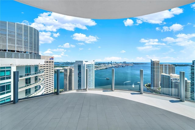 balcony featuring a water view