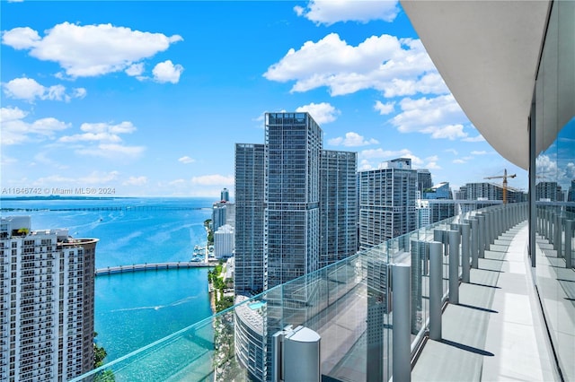 balcony featuring a water view