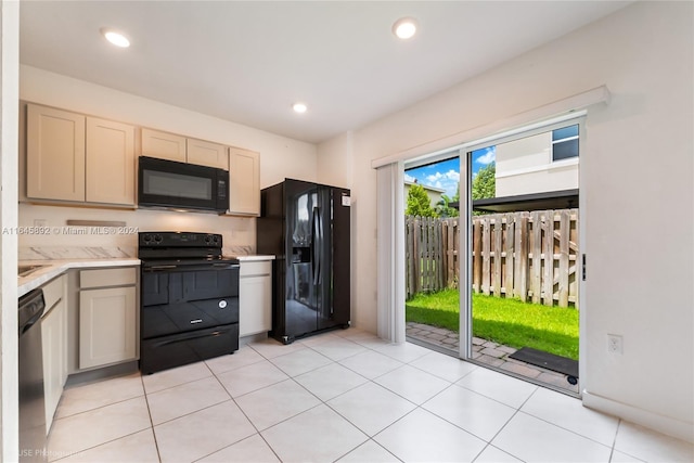 kitchen featuring recessed lighting, light countertops, black appliances, and light tile patterned floors