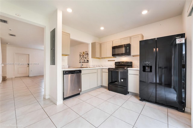 kitchen featuring light tile patterned floors, visible vents, light countertops, black appliances, and recessed lighting