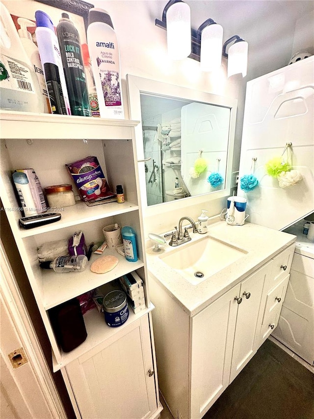 bathroom with an enclosed shower and vanity