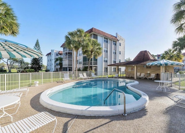 view of swimming pool with a patio