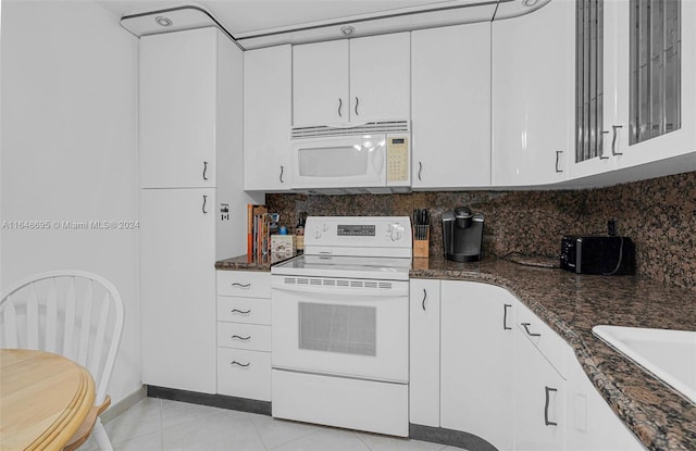 kitchen with white cabinets, white appliances, and decorative backsplash