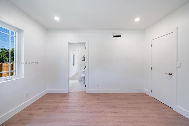 spare room featuring light wood-type flooring