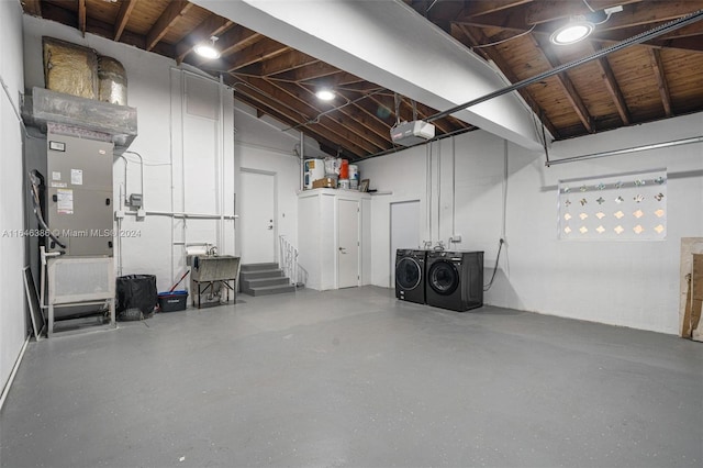 basement with wooden ceiling and independent washer and dryer