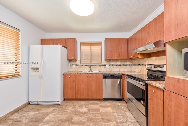 kitchen with light tile patterned flooring, stainless steel appliances, and decorative backsplash