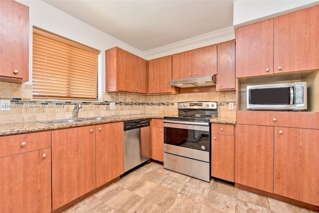 kitchen with light tile patterned floors, appliances with stainless steel finishes, sink, and tasteful backsplash