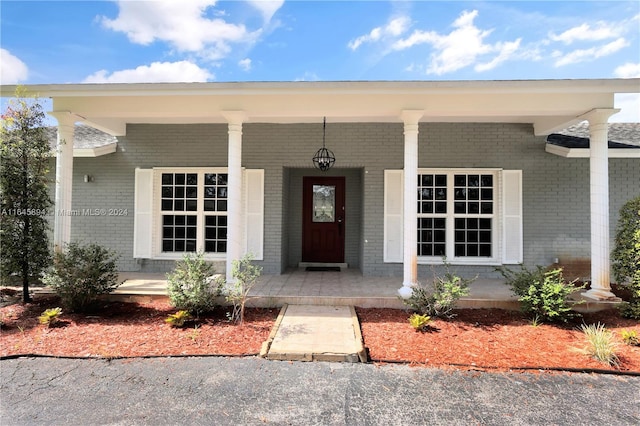 entrance to property with covered porch