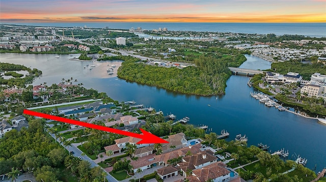 aerial view at dusk with a water view