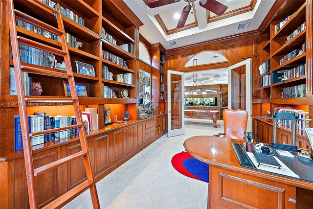 tiled office with coffered ceiling, beamed ceiling, crown molding, ceiling fan, and wooden walls