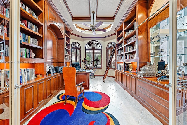 office area featuring ornamental molding, a textured ceiling, light tile patterned floors, and ceiling fan