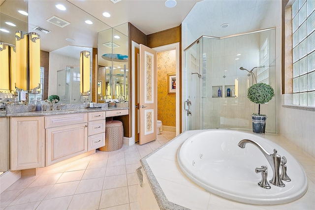 full bathroom with vanity, toilet, tile patterned floors, and shower with separate bathtub