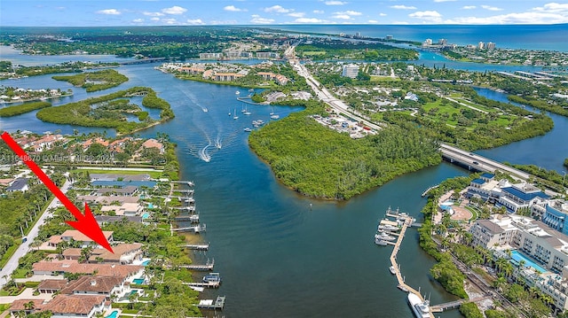 birds eye view of property with a water view