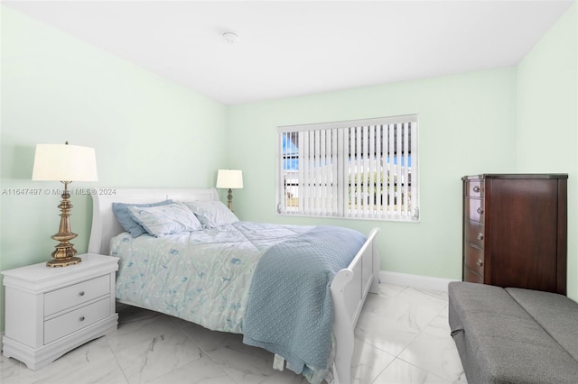 bedroom with light tile patterned floors