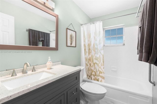 full bathroom featuring vanity, shower / bath combo, and toilet