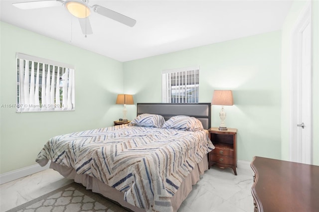 bedroom featuring tile patterned flooring and ceiling fan