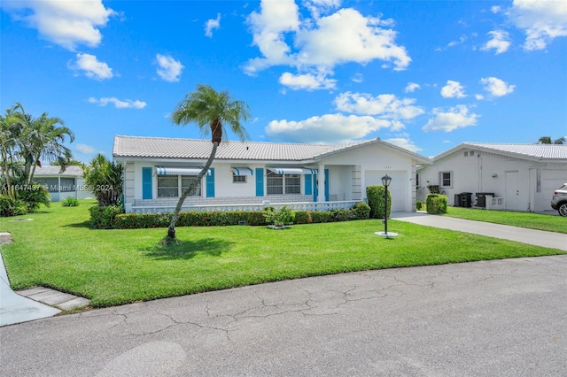 single story home with a front lawn and a garage