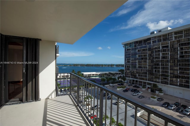 balcony featuring a water view