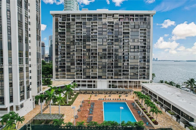 view of pool featuring a water view